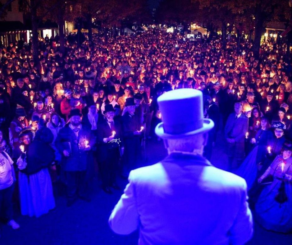 A large candlelight gathering filling Downtown Fayetteville